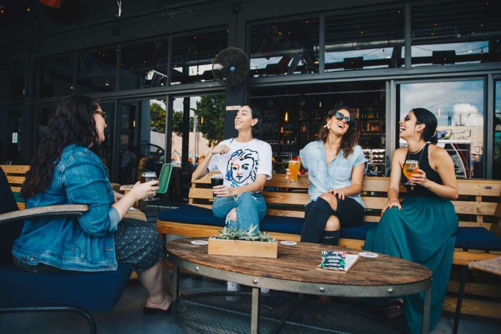 Friends sharing a toast at a table