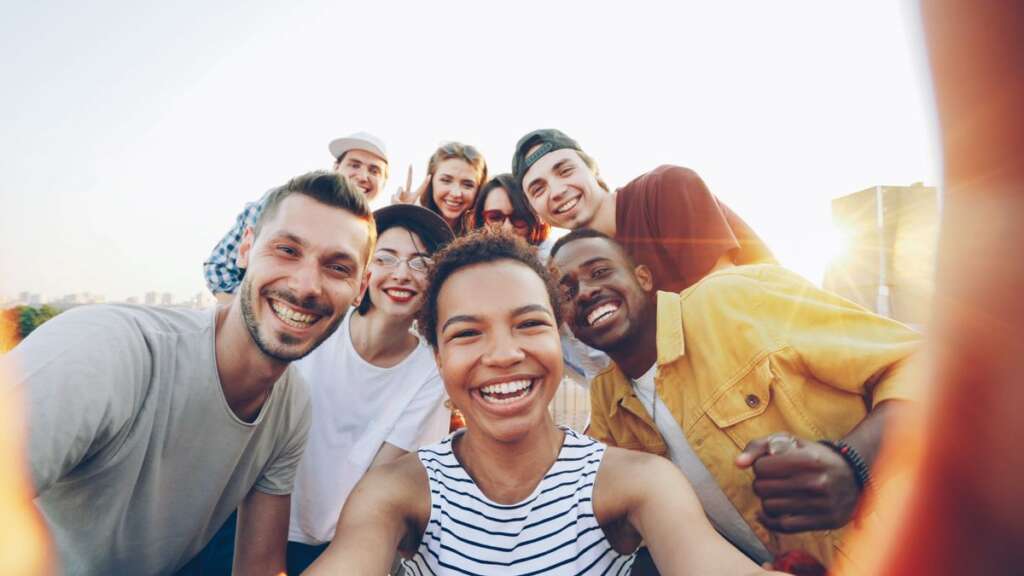 Professionals networking and smiling outdoors