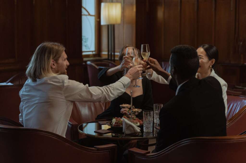 Diverse group toasting with drinks
