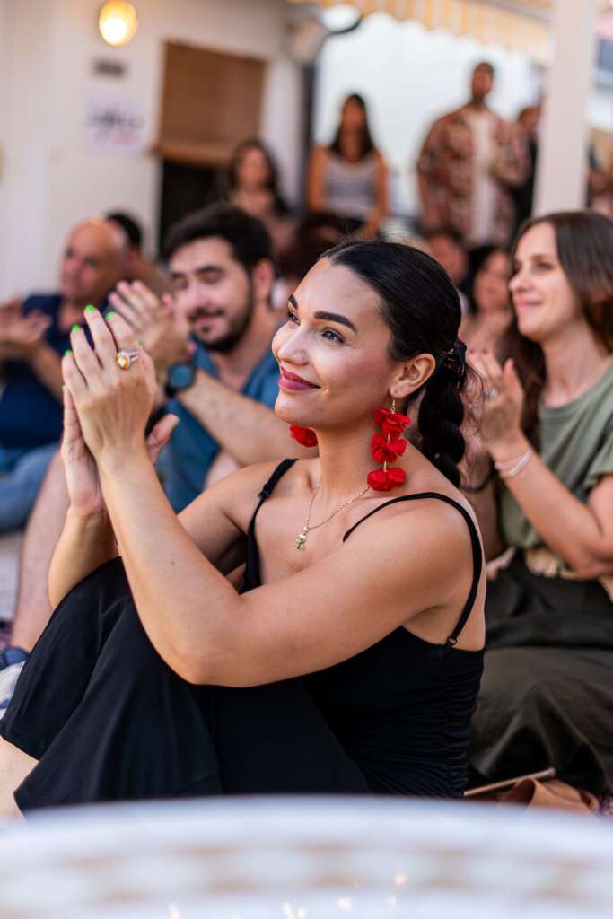 Elegant audience applauding at a fundraising gala