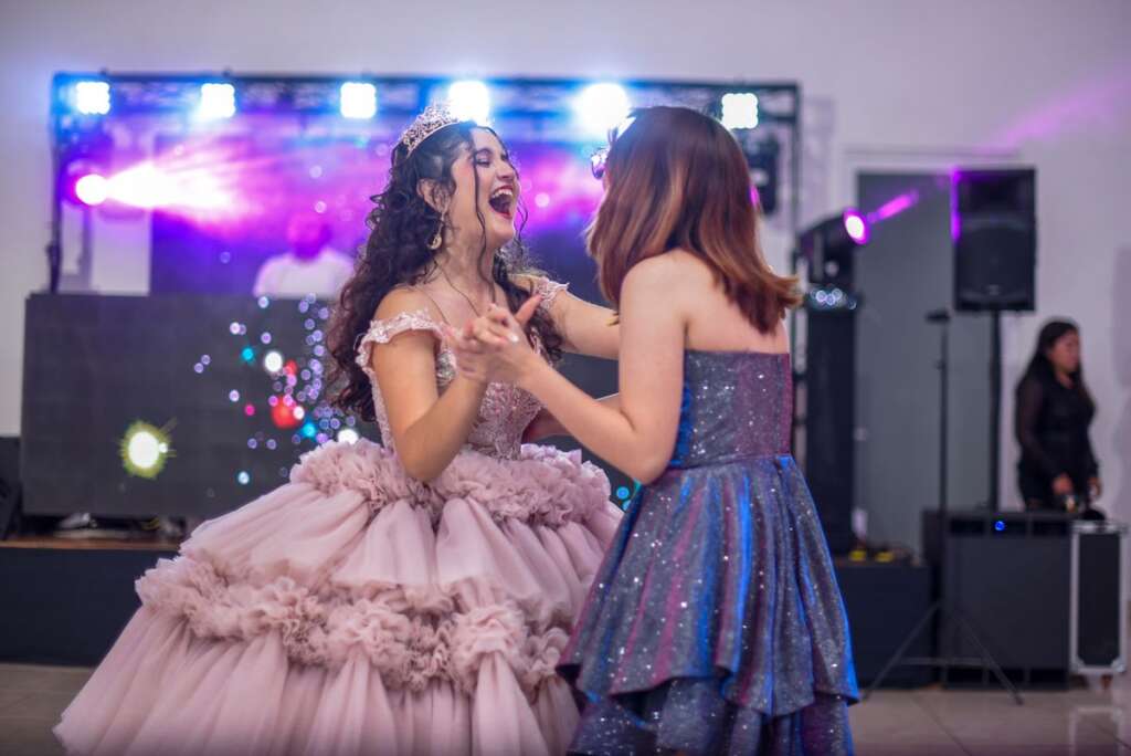 Quinceañera dancing the vals at her celebration